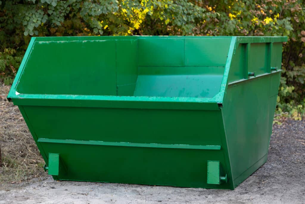 empty large green dumpster